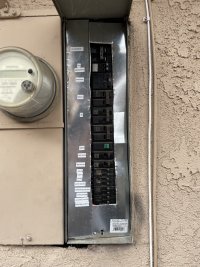The circuit breaker at the service panel with the dead-front in place and removed..jpeg
